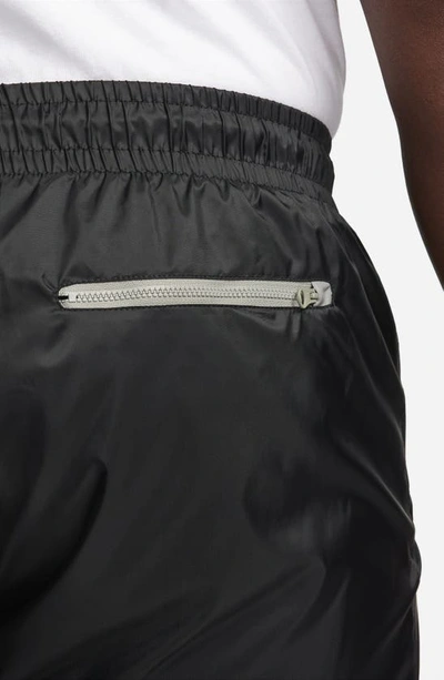 Shop Nike Windrunner Woven Lined Pants In Black/ Dark Stucco/ Saturn