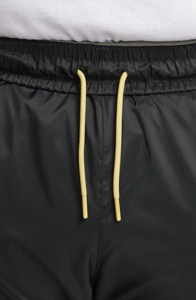 Nike Men's Windrunner Woven Lined Pants In Black/ Dark Stucco/ Saturn