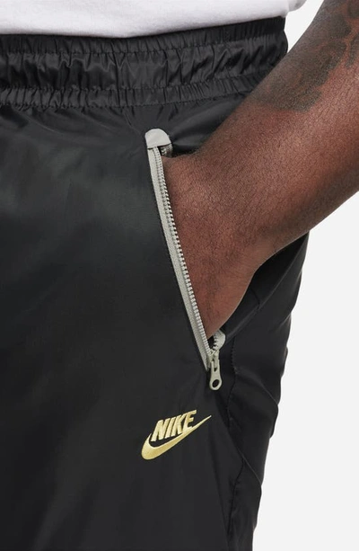 Nike Men's Windrunner Woven Lined Pants In Black/ Dark Stucco/ Saturn