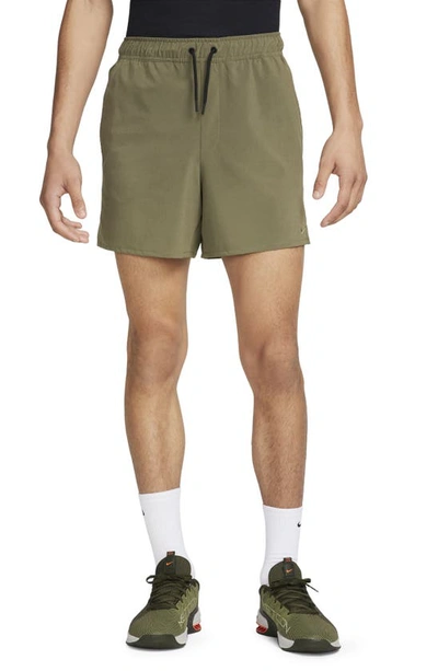 Shop Nike Dri-fit Unlimited 5-inch Athletic Shorts In Medium Olive/ Black