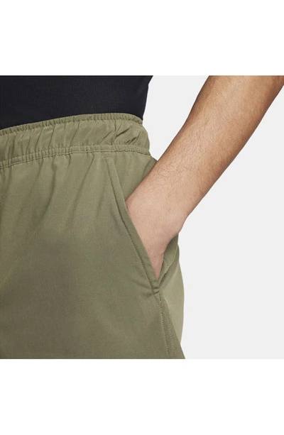 Shop Nike Dri-fit Unlimited 5-inch Athletic Shorts In Medium Olive/ Black