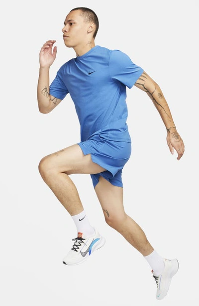 Shop Nike Dri-fit Unlimited 5-inch Athletic Shorts In Star Blue/ Black/ Star Blue