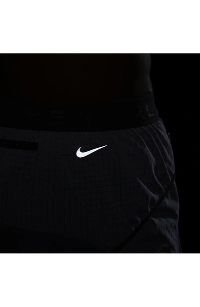 Shop Nike Dri-fit Trail Running Shorts In Thunder Blue/ Carbon/ Black