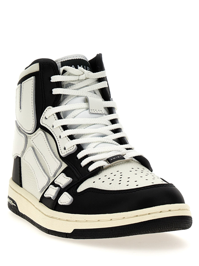 Shop Amiri Skel Top Hi Sneakers In White/black