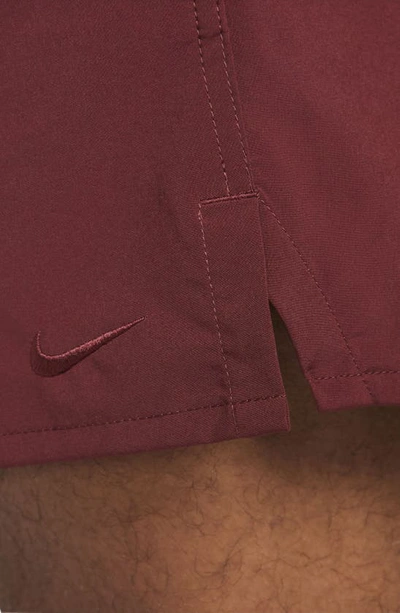 Shop Nike Dri-fit Unlimited 5-inch Athletic Shorts In Dark Team Red/ Black