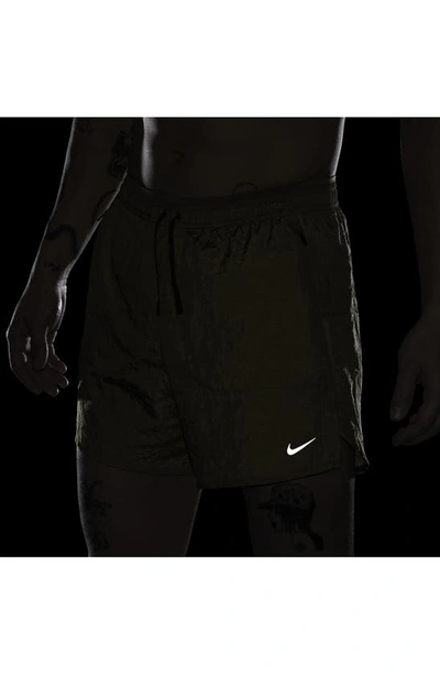 Shop Nike Dri-fit Stride Running Division Shorts In Pacific Moss/ Black