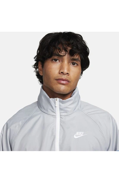 Shop Nike Water Repellent Half Zip Pullover In Wolf Grey/ Star Blue/ White