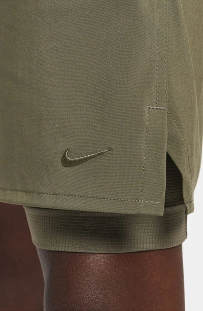 Shop Nike Dri-fit Unlimited 2-in-1 Versatile Shorts In Medium Olive/ Medium Olive