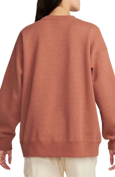 Shop Jordan Flight Fleece Oversize Crewneck Sweatshirt In Dusty Peach/ Heather