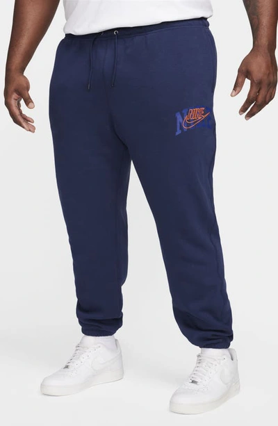 Shop Nike Club Fleece Sweatpants In Midnight Navy/ Safety Orange