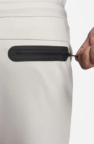 Shop Nike Lightweight Tech Knit Shorts In Light Iron Ore/ Black