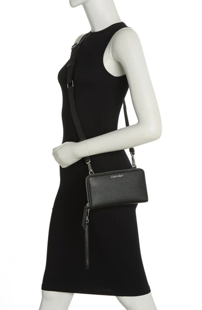 Shop Calvin Klein Marble Crossbody Bag In Black/ Silver