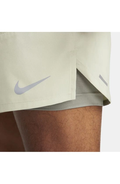 Shop Nike Dri-fit Stride 2-in-1 Running Shorts In Olive Aura/ Dark Stucco