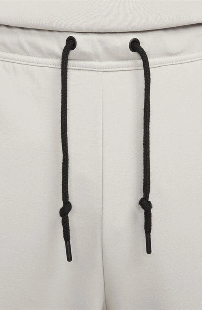 Shop Nike Lightweight Tech Knit Joggers In Light Iron Ore/ Black