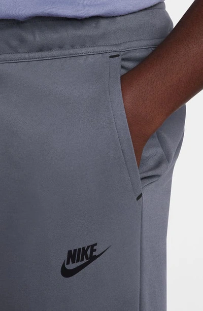 Shop Nike Lightweight Tech Knit Joggers In Light Carbon/ Black