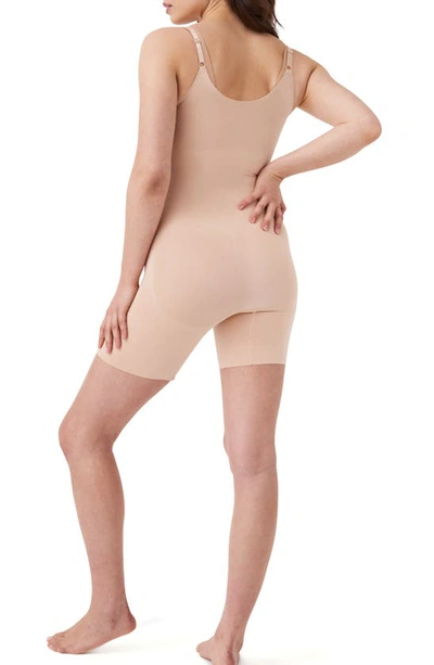 Shop Spanx Oncore Open Bust Mid Thigh Shaper Bodysuit In Soft Beige