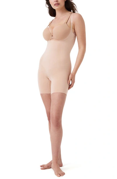 Shop Spanx Oncore Open Bust Mid Thigh Shaper Bodysuit In Soft Beige