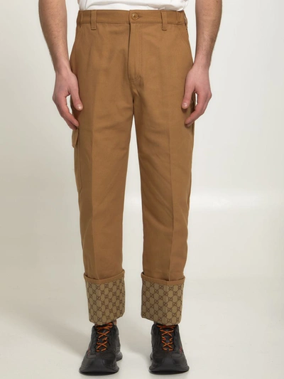Shop Gucci Beige Trousers With Gg Cuff