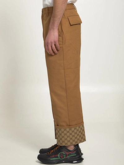 Shop Gucci Beige Trousers With Gg Cuff