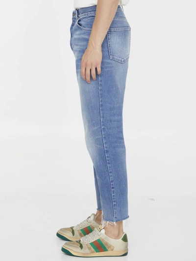 Shop Gucci Washed-out Denim Jeans In Blue