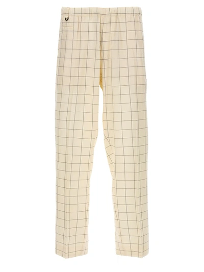 Shop Undercover Checkered Pants In White/black