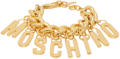Shop Moschino Gold Lettering Charm Bracelet In A0606 Shiny Gold
