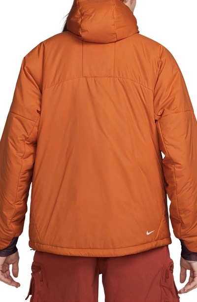 Shop Nike Acg Therma-fit Adv Rope De Dope Water Repellent Insulated Packable Jacket In Campfire Orange/ Summit White