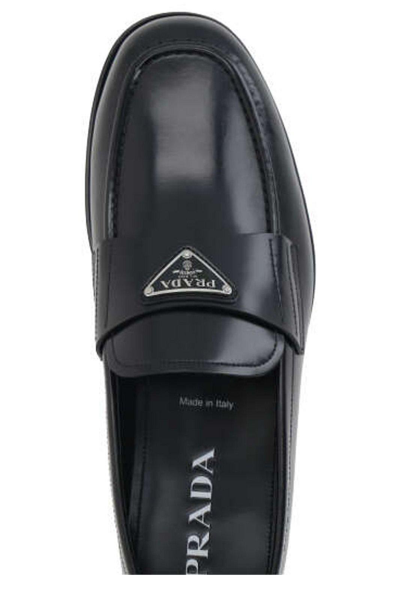 Shop Prada Logo Plaque Almond-toe Loafers In Nero
