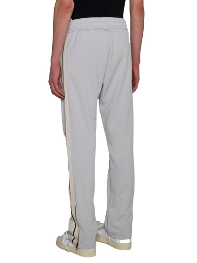Shop Palm Angels Logo Embroidered Side Stripe Detailed Pants In Grigio Chiaro/nero