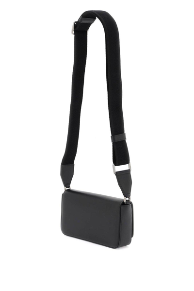 Shop Dolce & Gabbana Logo Embossed Mini Shoulder Bag