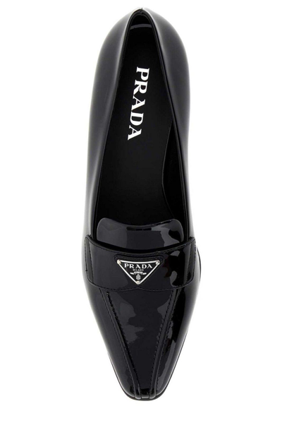 Shop Prada Logo-plaque Pointed Toe Loafers In Black