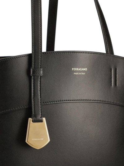 Shop Ferragamo Charming Logo-printed Top Handle Bag In Nero