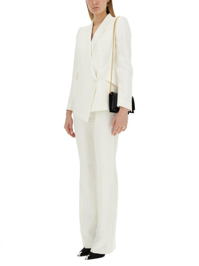Shop Alexander Mcqueen High-waist Flared Tailored Trousers In Bianco