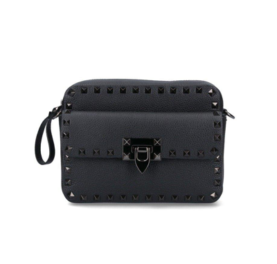 Shop Valentino Garavani Rockstud Zip-up Messenger Bag In Black