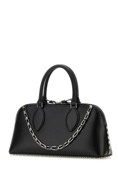 Shop Valentino Black Leather Rockstud Handbag In Nero