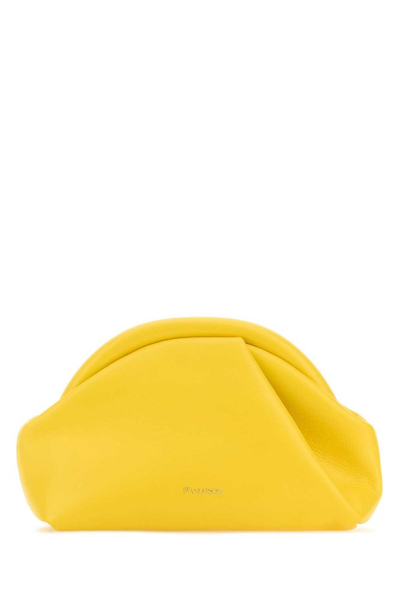 Shop Jw Anderson Bumper Zipped Clutch Bag In Yellow