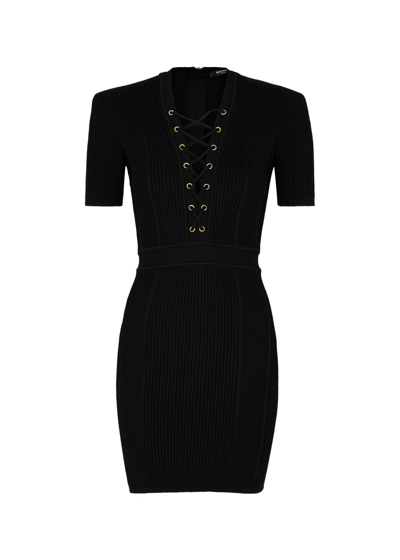 Shop Balmain Lace-up Ribbed-knit Mini Dress In Black