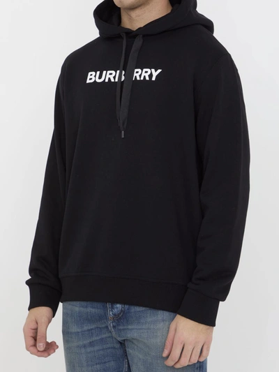 Shop Burberry Logo Hoodie In Black