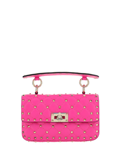Shop Valentino Garavani Rockstud Spike Foldover Top Shoulder Bag In Pink