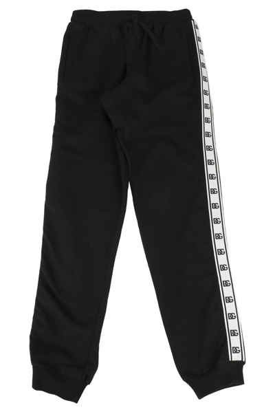Shop Dolce & Gabbana Kids Logo Printed Track Pants In Black