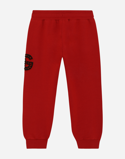 Shop Dolce & Gabbana Jersey Jogging Pants With Logo Patch In レッド