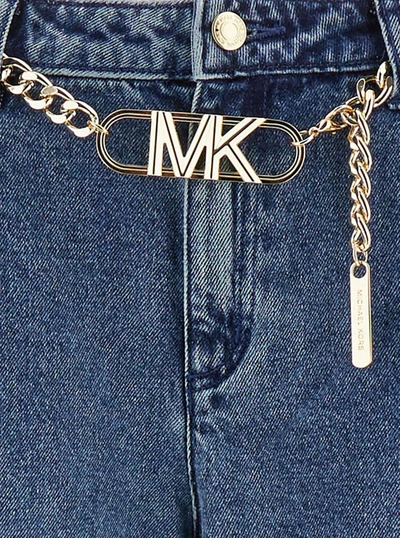 Shop Michael Michael Kors Blue Flared Jeans With Chain Belt In Denim Woman In Beige