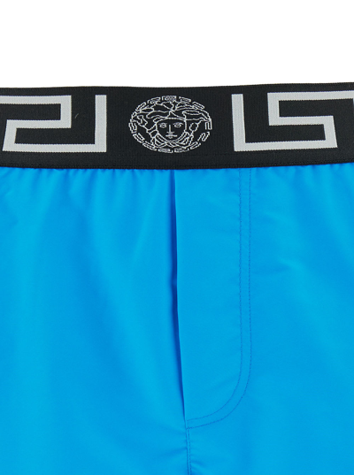 Shop Versace Light Blue Swim Shorts With Greca Branded Band In Tech Fabric Man