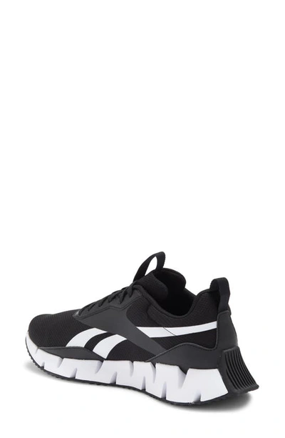 Shop Reebok Zig Dynamica Sneaker In Black/ White/ Black