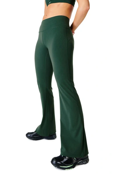 Shop Sweaty Betty Power Kick Flare Workout Pants In Trek Green