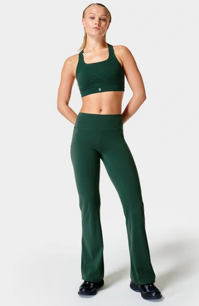 Shop Sweaty Betty Power Kick Flare Workout Pants In Trek Green