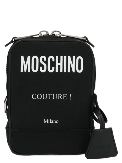 Shop Moschino 'label' Crossbody Bag In White/black