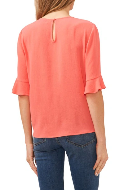 Shop Cece Ruffle Cuff Blouse In Calypso Coral