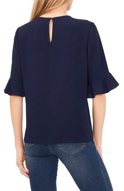 Shop Cece Ruffle Cuff Blouse In Classic Navy