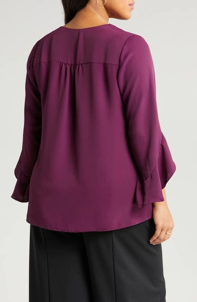 Shop Vince Camuto Flutter Sleeve Crossover Georgette Tunic Top In Pickled Beet